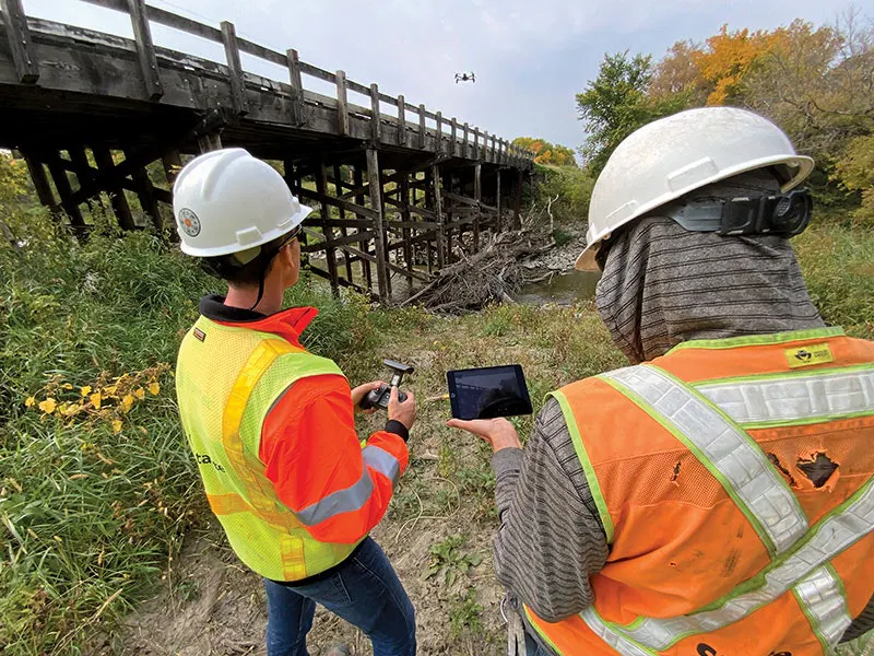 Female Bridge Inspector New bridge inspection techniques increase speed, efficiency, and safety ...