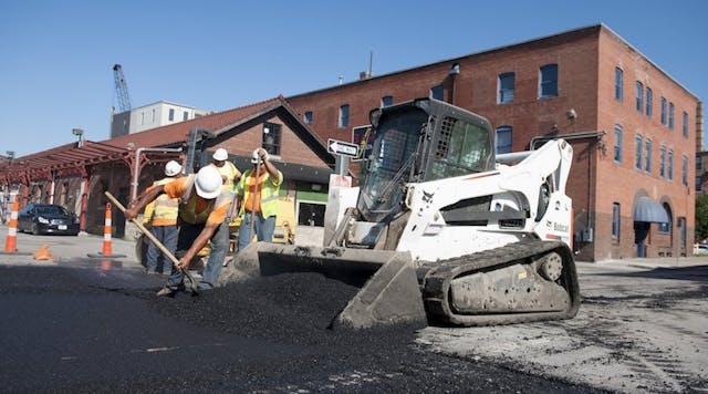 low-res-bobcat-t870-bucket-asphalt-paving-workers