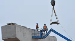Two Bridge Construction Workers Wait On Bridge Parts Alan Stoddard