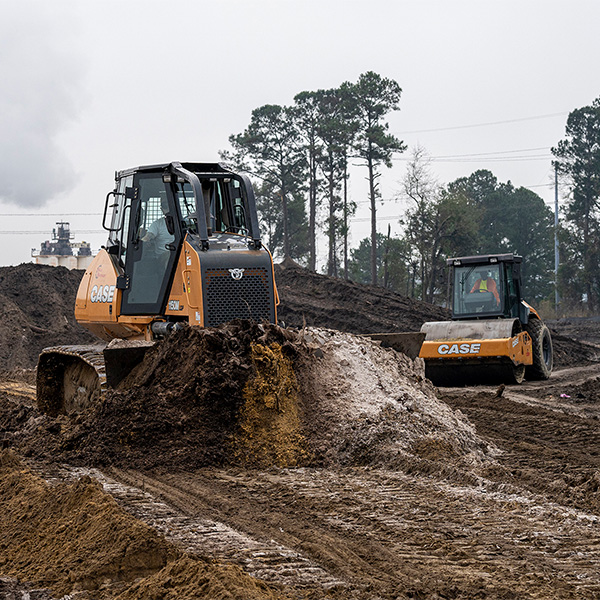 The CASE 1150M dozer and SV212D single drum vibratory roller are key machines for this project.