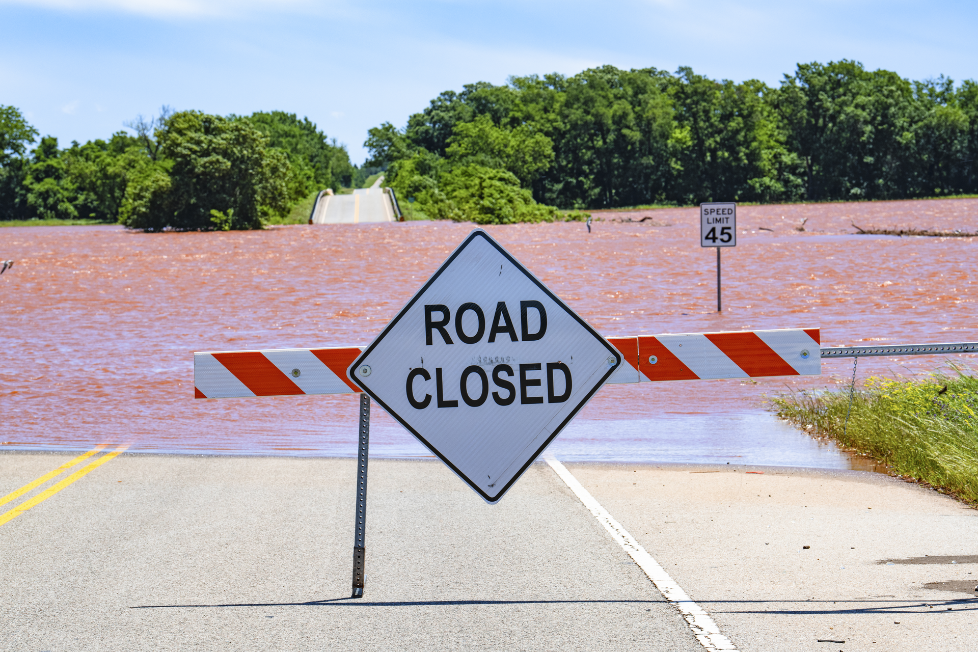Severe Flooding In Oklahoma With Road Closed Sign 62e3fd2e21152