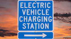 Electric Vehicle Charging Station Sign With Sunset Sky Trekandshoot