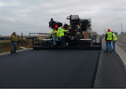 Paving full-width to eliminate longitudinal joint. Paving full-width to eliminate longitudinal joint.