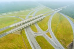 Early morning with low hanging fog looking over a meadow near highway US 65 in Satsuma, Alabama Early morning with low hanging fog looking over a meadow near highway US 65 in Satsuma, Alabama