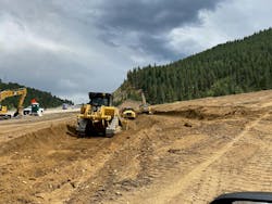 three_pieces_of_heavy_equipment_moving_dirt_for_th three_pieces_of_heavy_equipment_moving_dirt_for_th