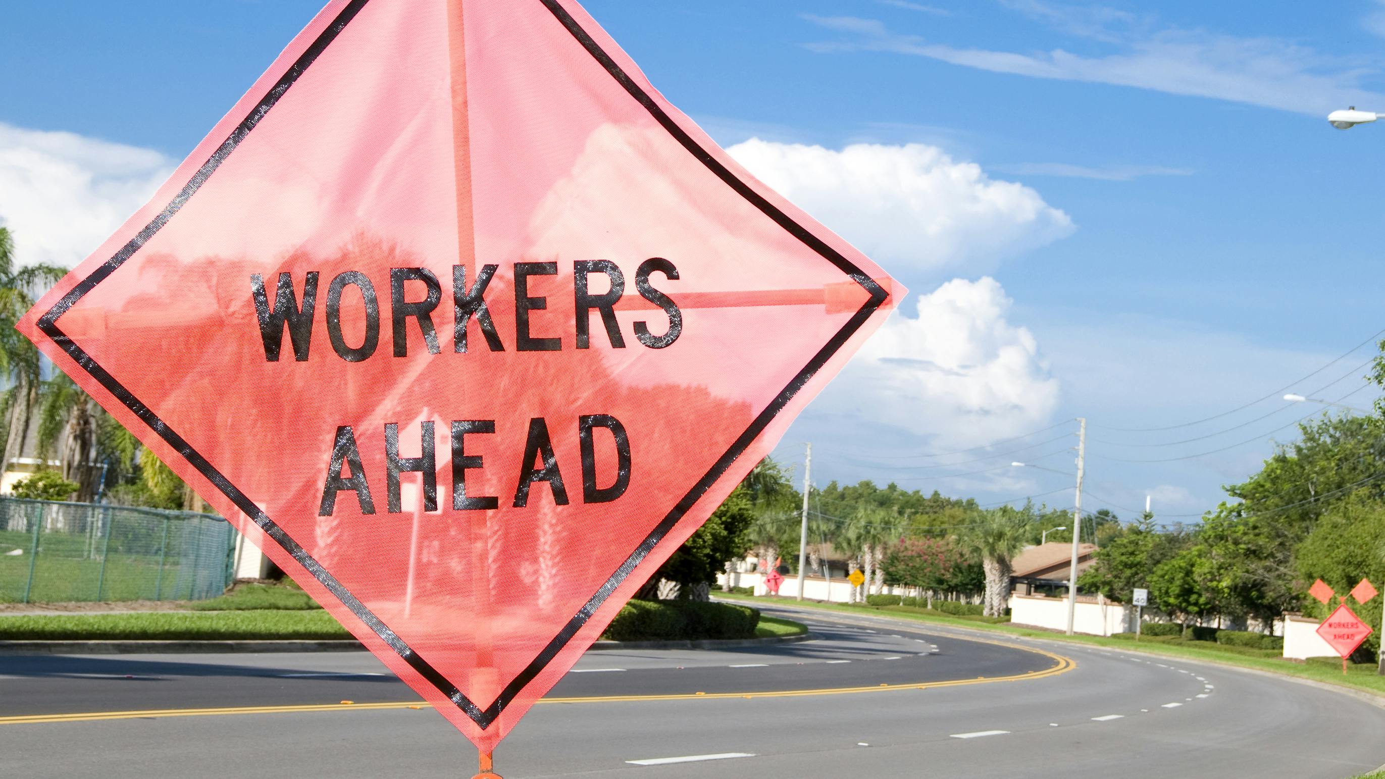 Workers ahead sign