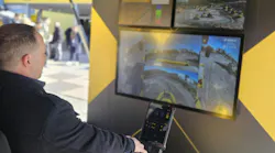 Gavin operating the BOMAG single drum roller simulator.