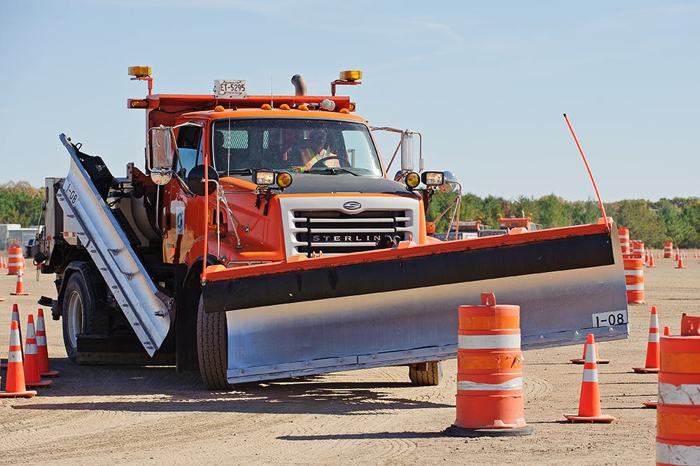 A snowplow operator practices on a Minnesota Department of Transportation training course.