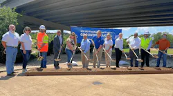 City, county and TxDOT officials pose for a ceremonial groundbreaking photo celebrating the addition of frontage roads along Toll 183A in Cedar Park, Texas.