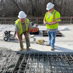 AtkinsRéalis Senior Bridge Inspector Jimmy Gragg measures depth during a deck pour alongside AtkinsRéalis Construction Inspector Mentee Kaleb Temples. AtkinsRéalis Senior Bridge Inspector Jimmy Gragg measures depth during a deck pour alongside AtkinsRéalis Construction Inspector Mentee Kaleb Temples.