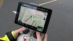 Sensor operator performing an in-flight inspection of a deck truss. Sensor operator performing an in-flight inspection of a deck truss.