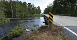 Water rising under a bridge after Hurricane Florence near Fayetteville, North Carolina in 2018. Water rising under a bridge after Hurricane Florence near Fayetteville, North Carolina in 2018.
