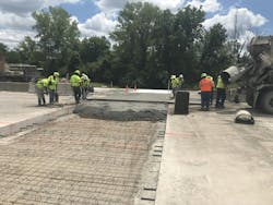 Construction workers are laying out concrete for a newly updated interchange in Kansas City, Kansas. Construction workers are laying out concrete for a newly updated interchange in Kansas City, Kansas.