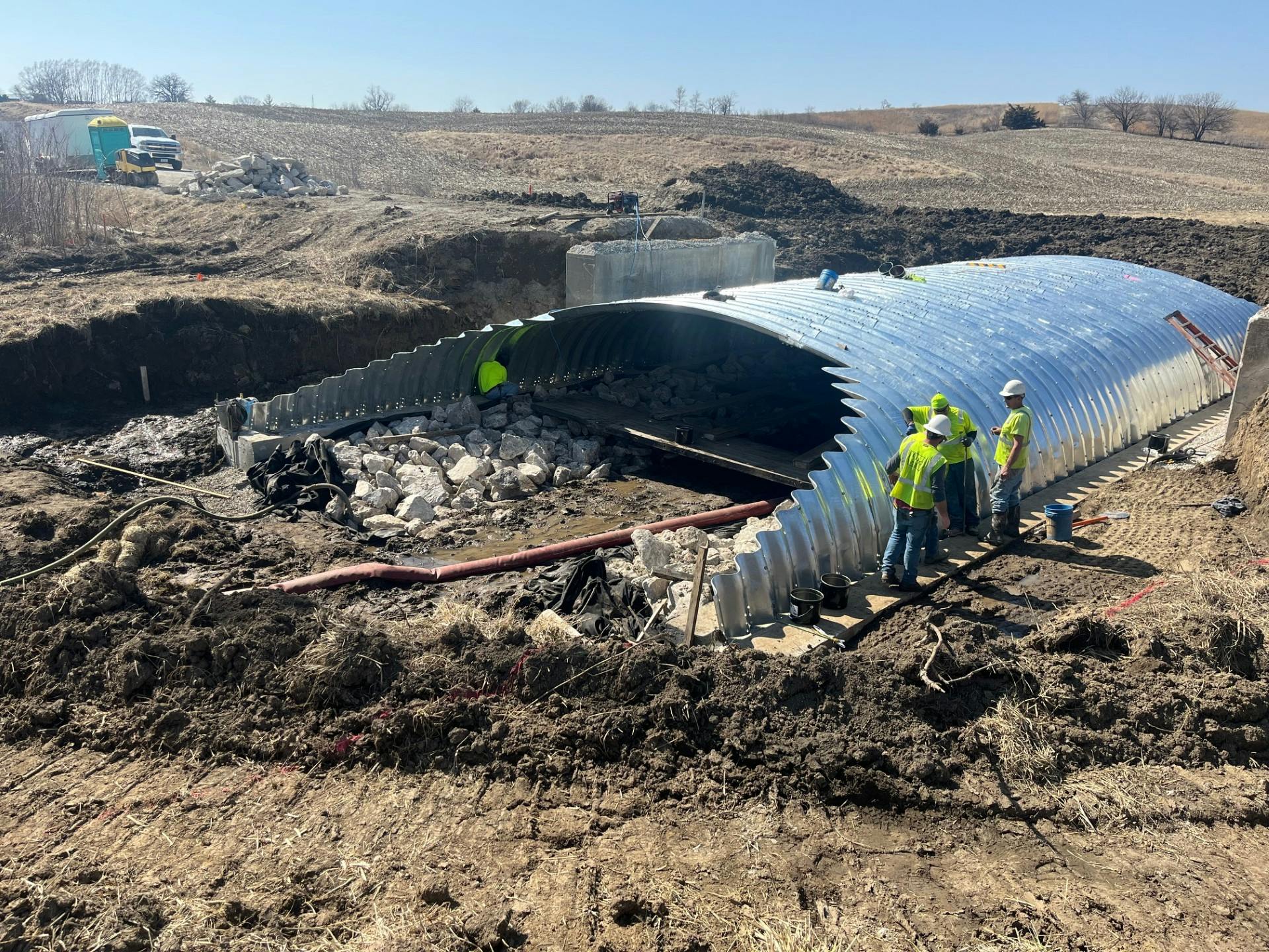 Construction workers building a new buried bridge in Iowa.