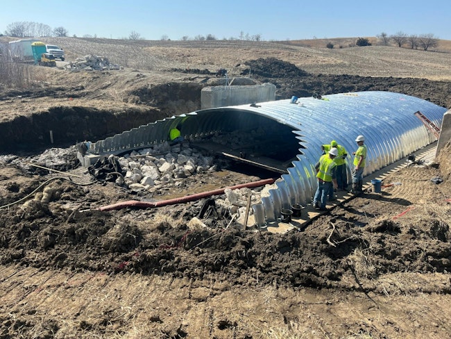 Construction workers building a new buried bridge in Iowa.
