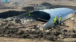 Construction workers building a new buried bridge in Iowa.