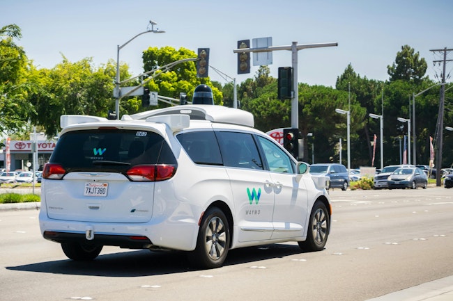 A Waymo robotaxi riding through Silicon Valley.