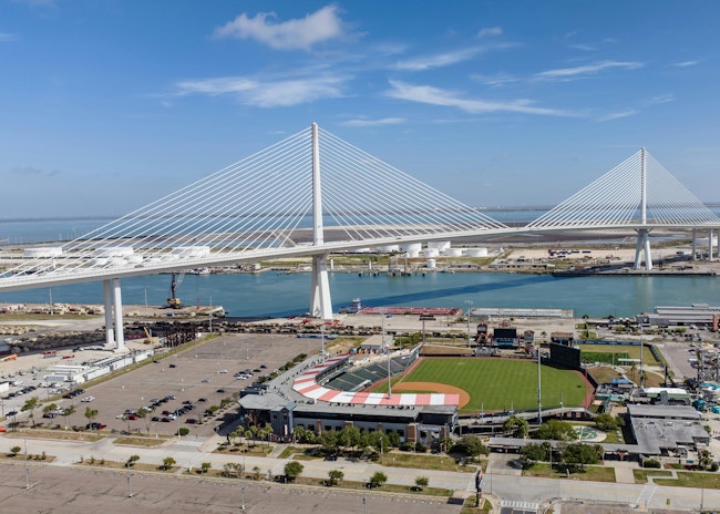 New Harbor Bridge in Corpus Christi, Texas stands tall behind Whataburger Field.