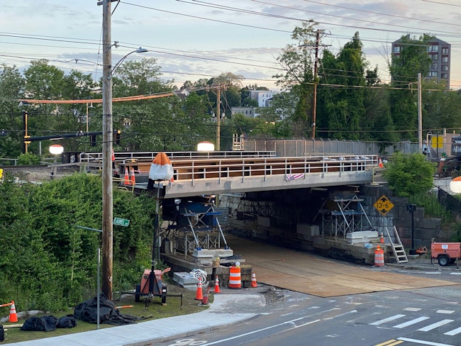 The steel superstructure on temporary shoring adjacent to Its final location in Haverhill, Massachusetts.