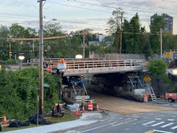 The steel superstructure on temporary shoring adjacent to Its final location in Haverhill, Massachusetts. The steel superstructure on temporary shoring adjacent to Its final location in Haverhill, Massachusetts.