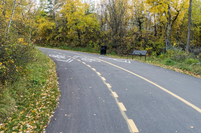 A shared use pathway through a green area.