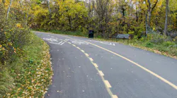 A shared use pathway through a green area.