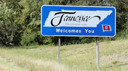 A Welcome to Tennessee sign displayed on the side of a highway