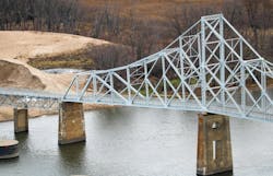 The Black Hawk Bridge crossing over the Mississippi River from Wisconsin to Iowa. The Black Hawk Bridge crossing over the Mississippi River from Wisconsin to Iowa.