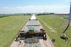 Crews using machinery to complete an accelerated concrete overlay on Iowa Highway 3. Crews using machinery to complete an accelerated concrete overlay on Iowa Highway 3.