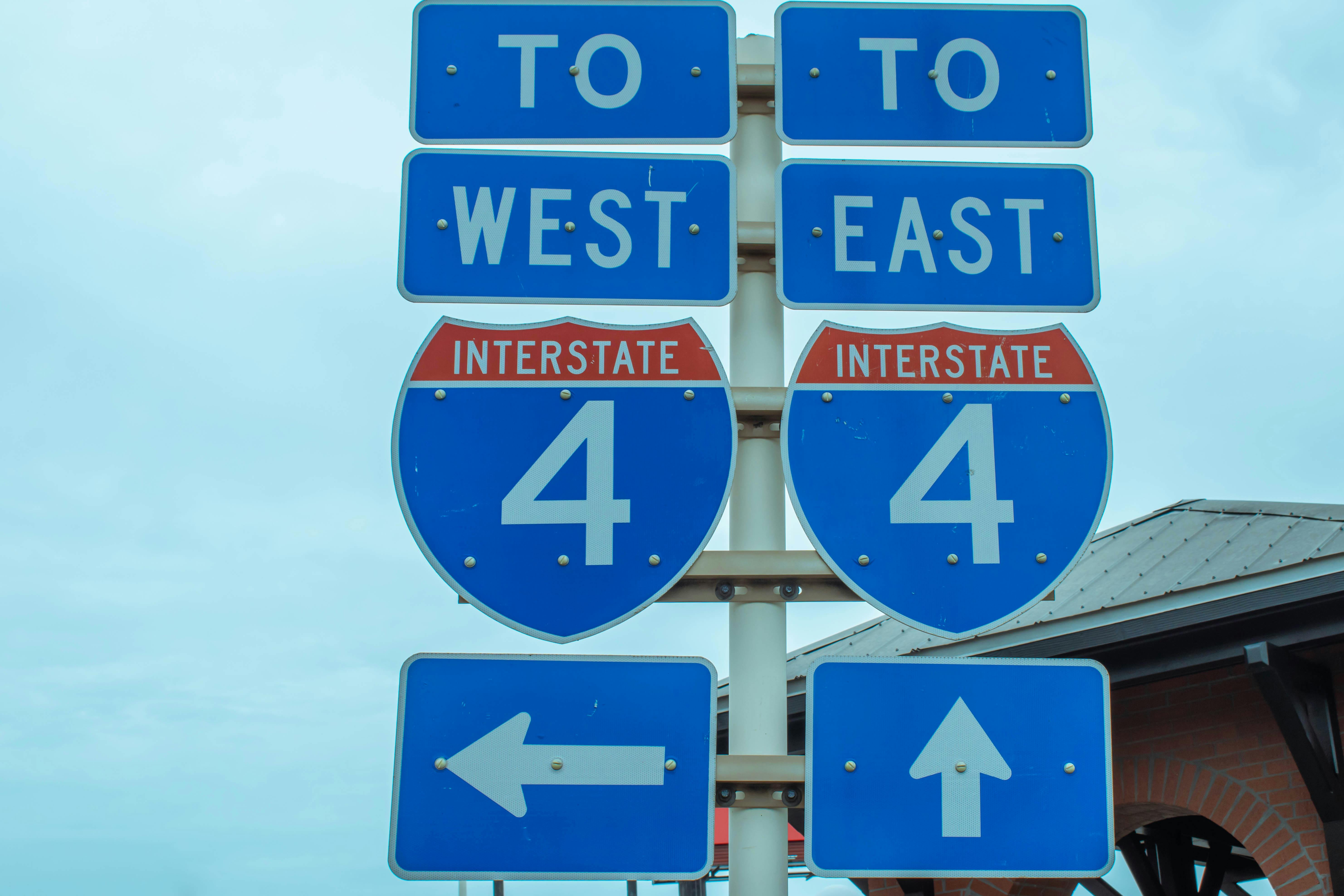 A pair of road signs leading traffic to Interstate 4 in Florida.