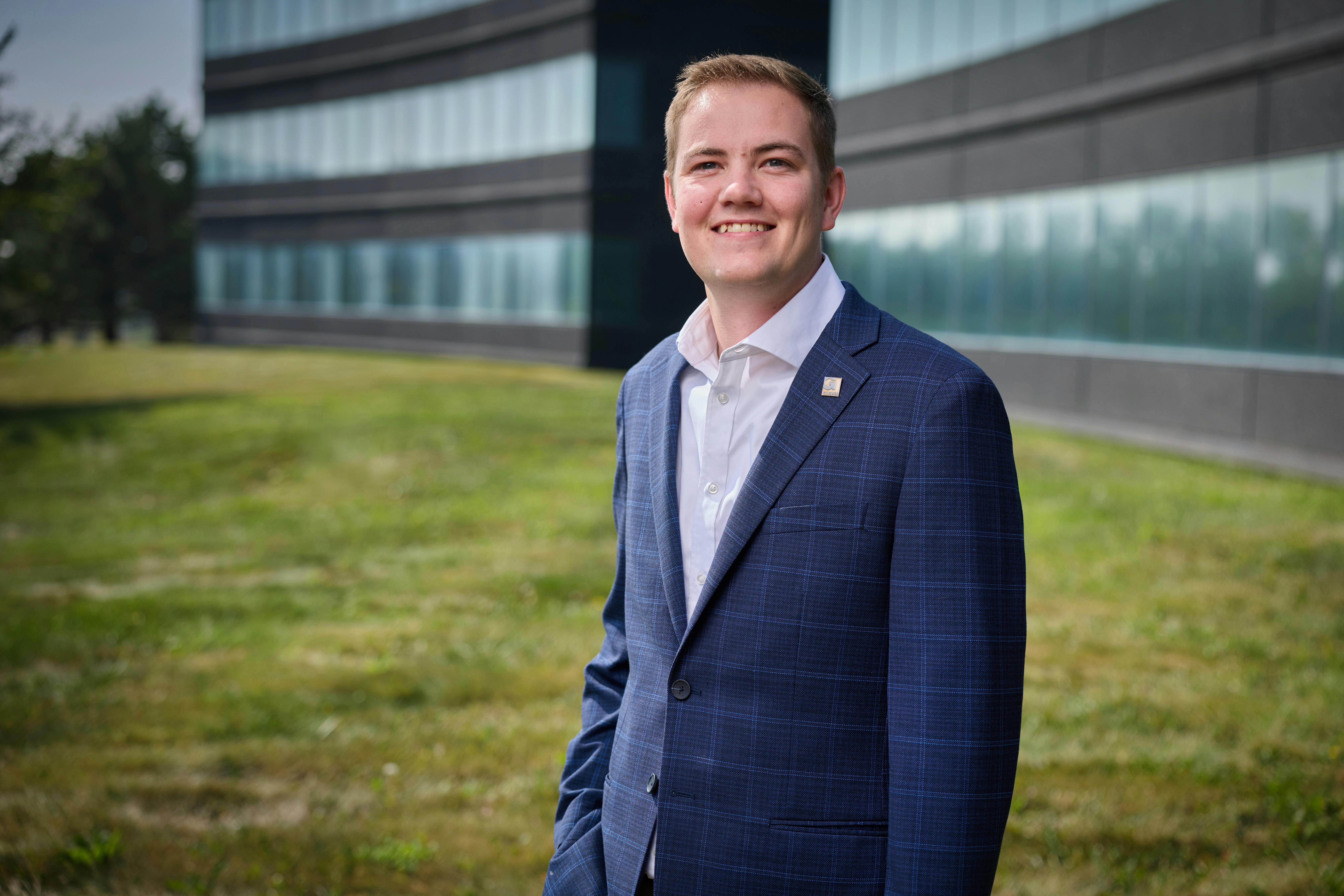 Mac Milburn poses outside of Garver.