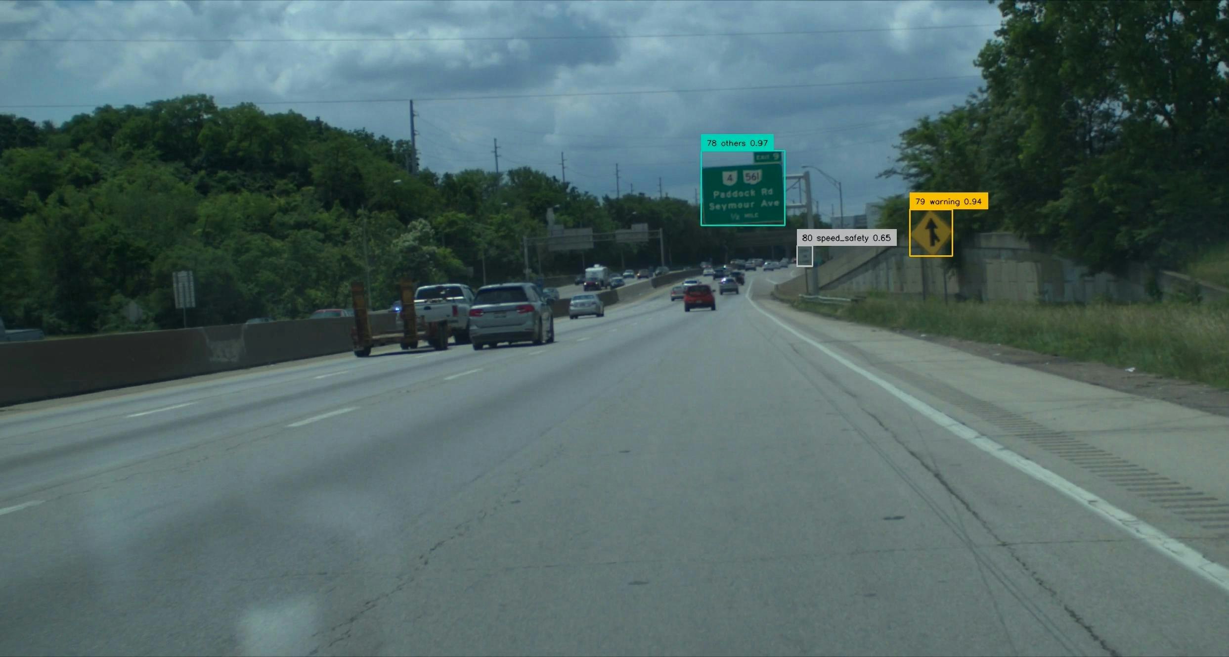 A still image captured by Honda's Proactive Roadway Maintenance System showing deteriorated road signs.