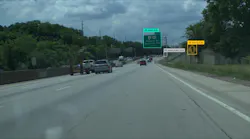 A still image captured by Honda's Proactive Roadway Maintenance System showing deteriorated road signs.