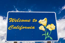 A welcome to California sign along a highway. A welcome to California sign along a highway.