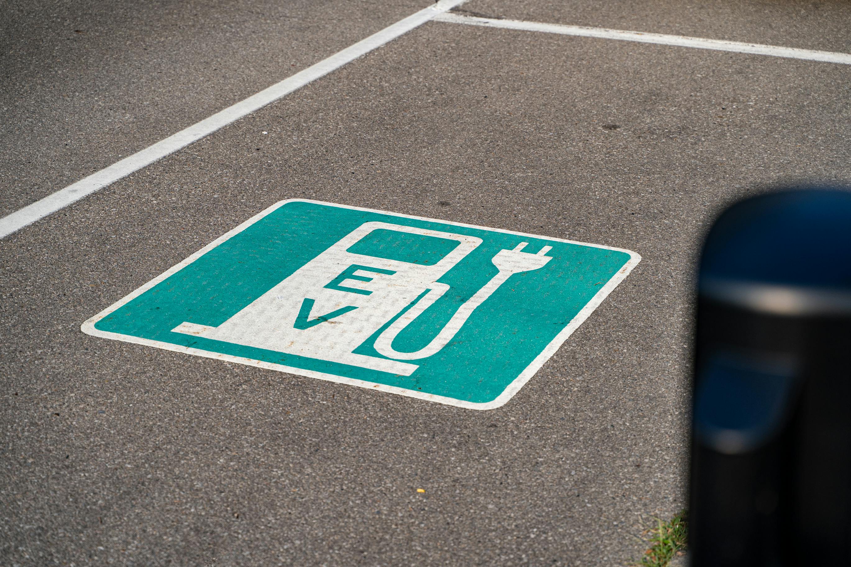 An electric vehicle charger symbol demarcating the roadway.