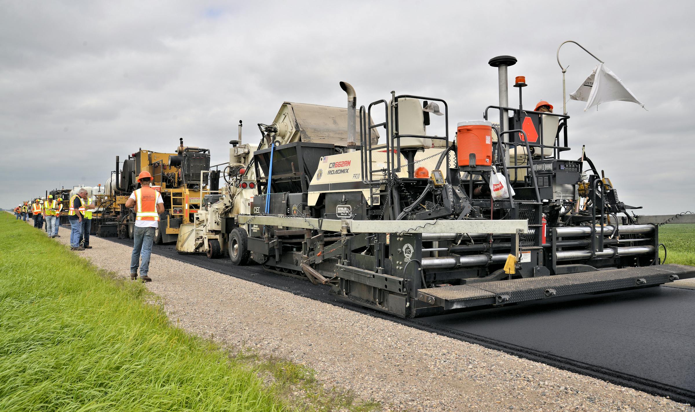 A multi-unit recycling train is working to conduct the Hot Recycling Process on CSAH 9 in Polk County, Minn.