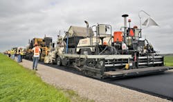 A multi-unit recycling train is working to conduct the Hot Recycling Process on CSAH 9 in Polk County, Minn. A multi-unit recycling train is working to conduct the Hot Recycling Process on CSAH 9 in Polk County, Minn.