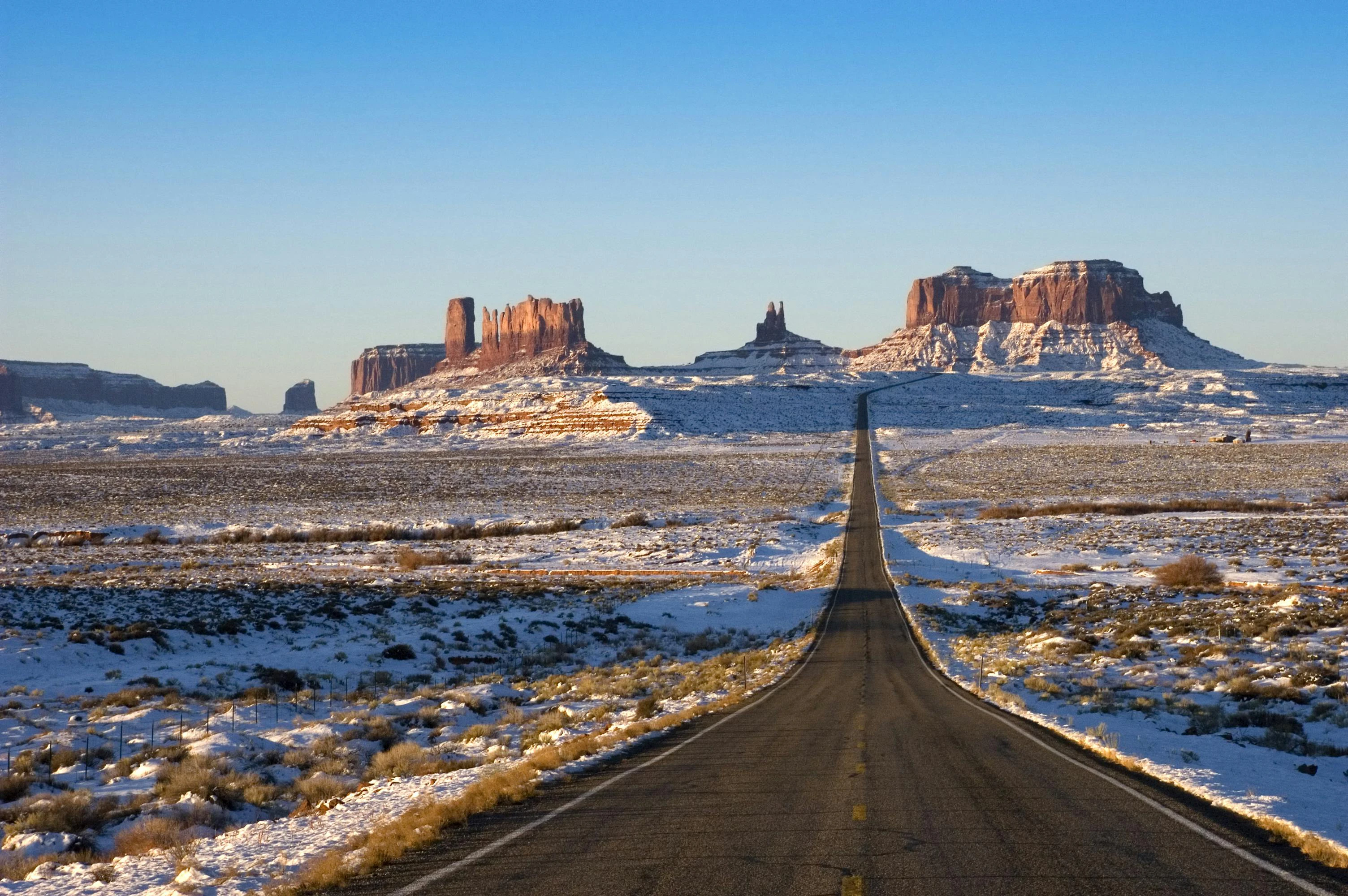 The roadway entering Monument Valley Navajo Tribal Park on the border between Utah and Arizona.