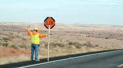 Construction crew man controling traffic
