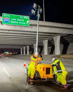 Crews working on a highway at night. Crews working on a highway at night.