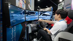 An attendee testing out a driving simulator at ITS America Conference & Expo.