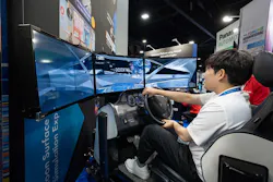 An attendee testing out a driving simulator at ITS America Conference & Expo. An attendee testing out a driving simulator at ITS America Conference & Expo.