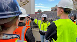 A tour guide showing students with The Beavers the SR 520 Portage Bay Bridge job site in Seattle.