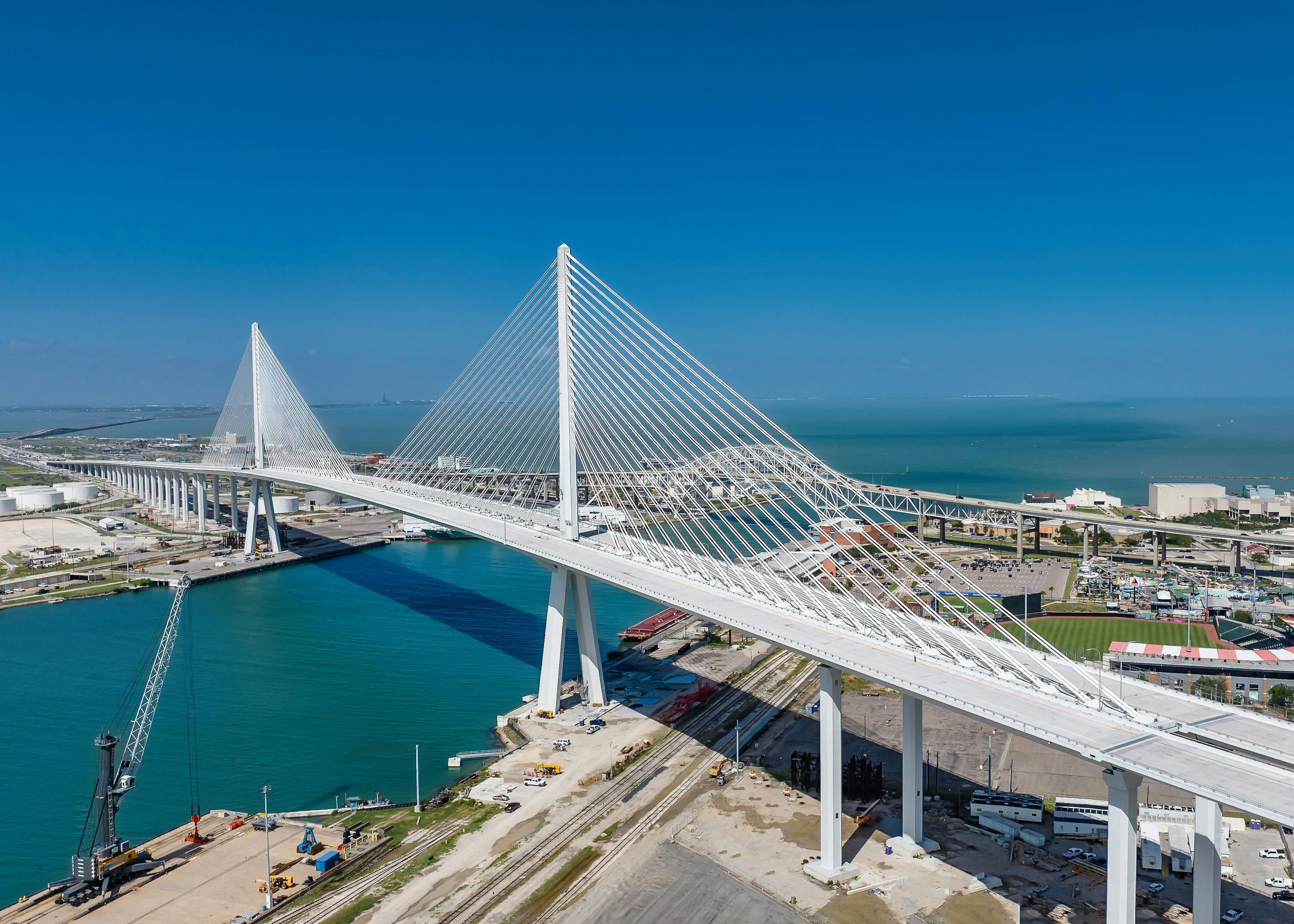 New Harbor Bridge in Corpus Christi, Texas stands tall behind Whataburger Field.