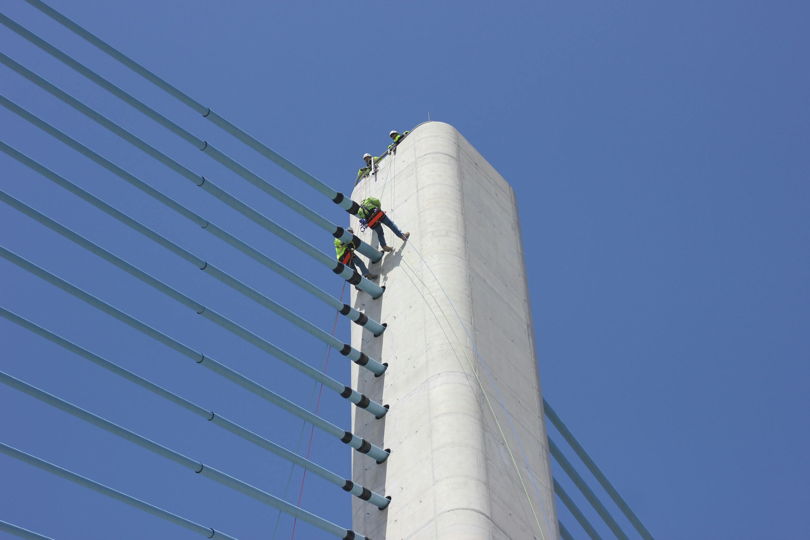Workers inspect the Charles W. Cullen Bridge in Bethany Beach, Del. More than 600,000 bridges in the U.S. are inspected on a regular cycle, and many of them have components that are difficult to reach.