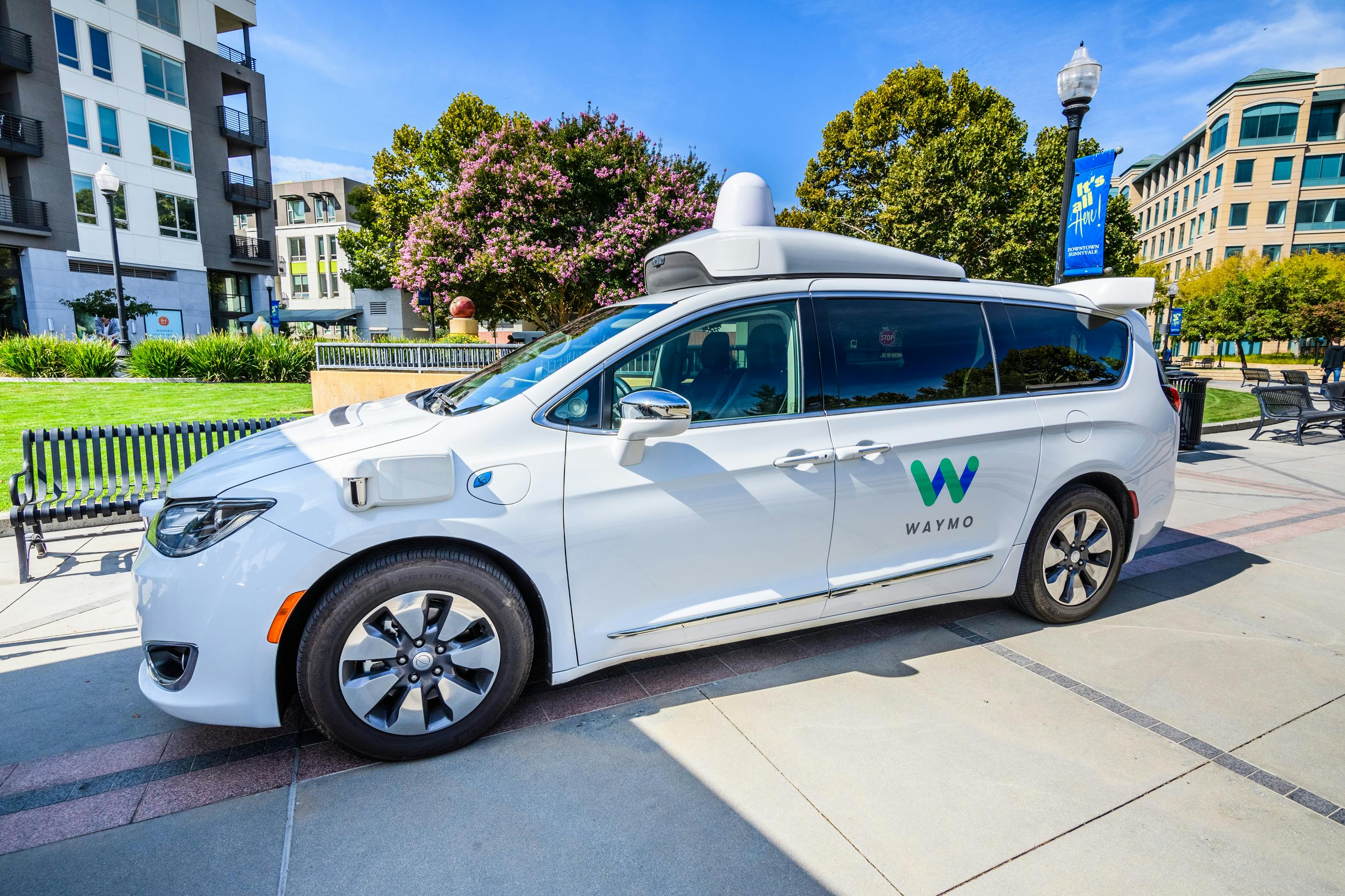 A Waymo van on a roadway.