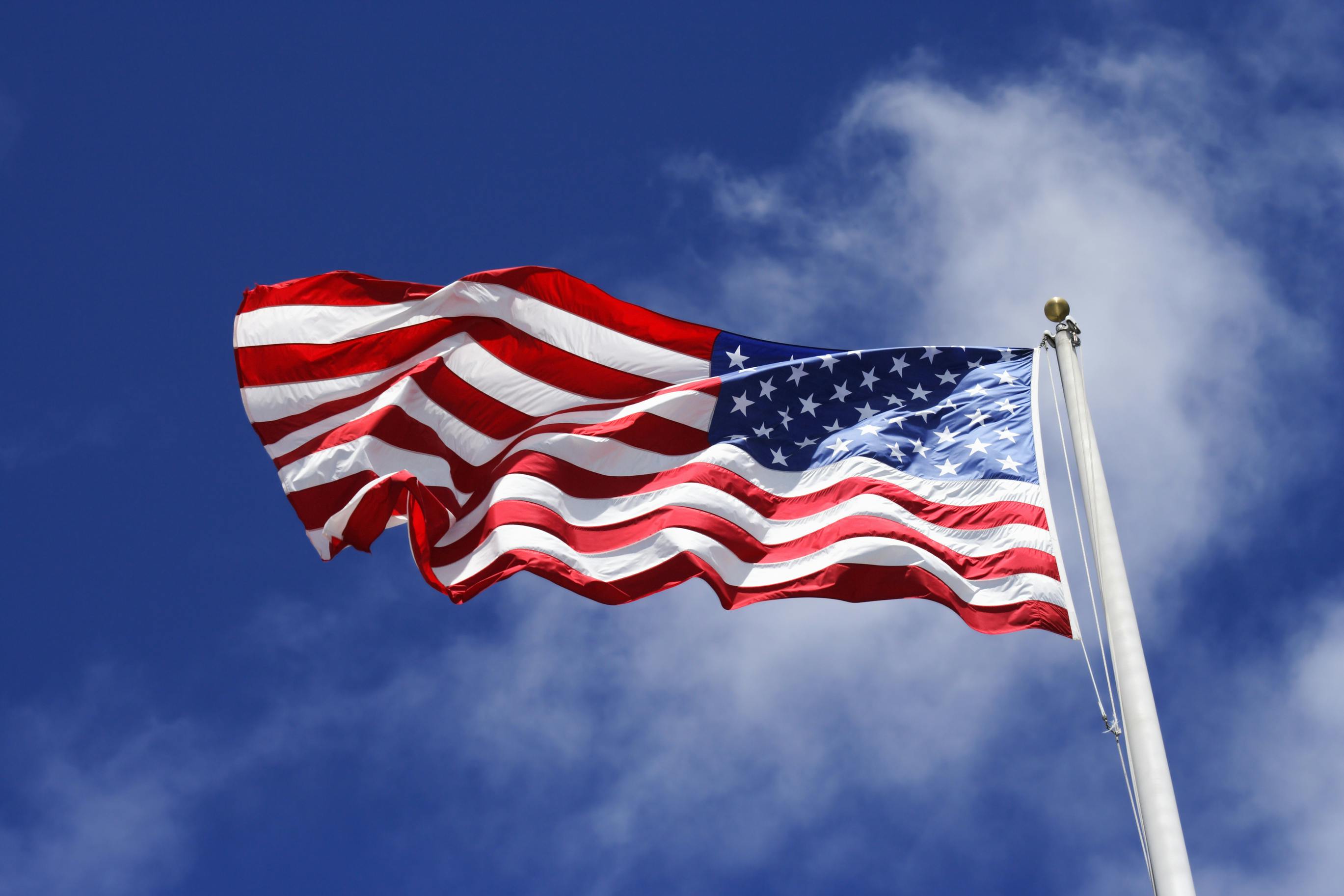 An American flag blowing in the wind.