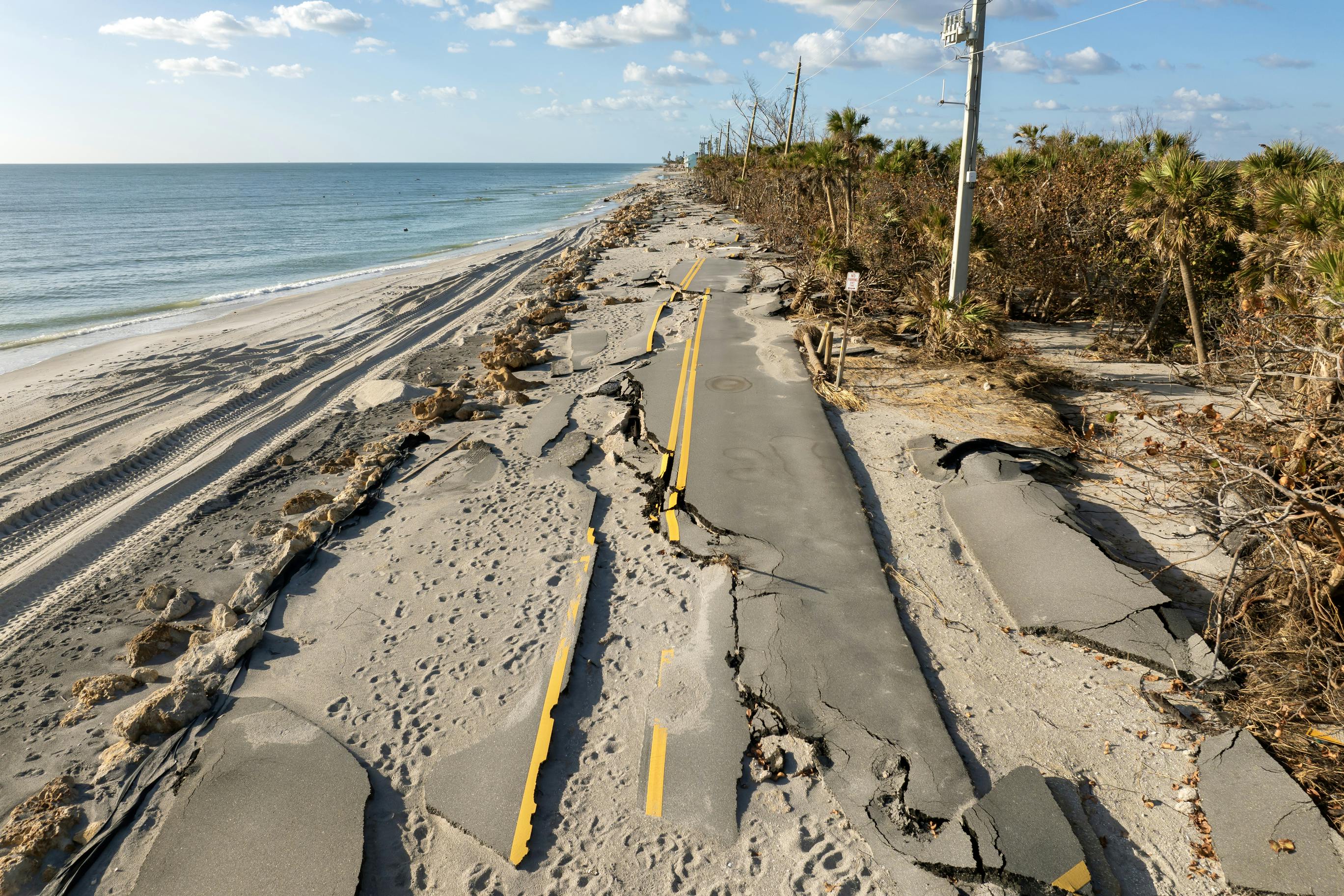 A storm surge from Hurricane Milton destroyed a section of Manasota Key Road near Blind Pass Beach