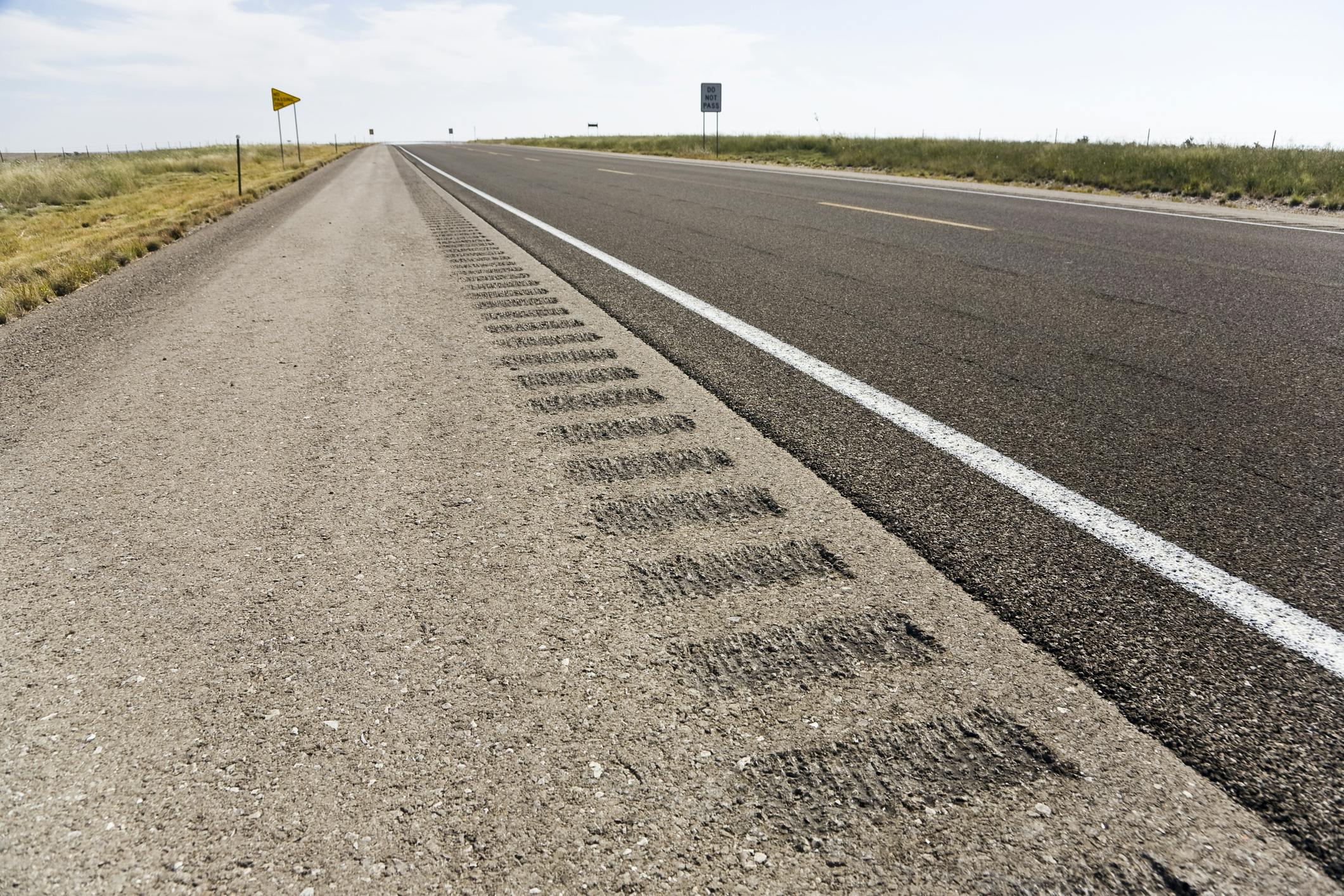 A rumble strip on a road shoulder.