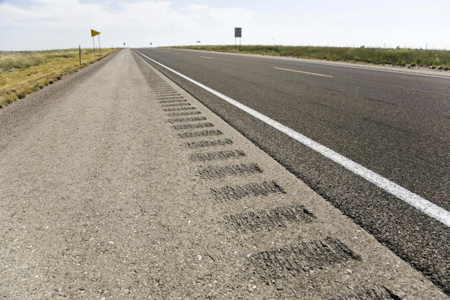 A rumble strip on a road shoulder.
